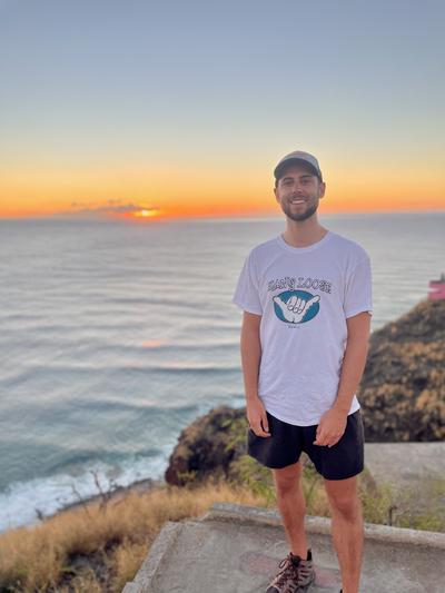 Joe Hutchinson at the pink pillbox overlook, Hawaii, during sunset.